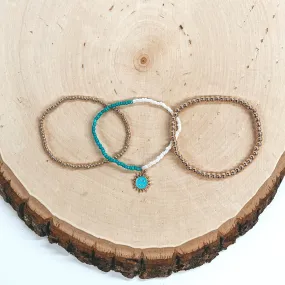 Set of Three | Gold Tone, Ivory, and Turquoise Beaded Bracelet Set with Happy Face Sun Pendant